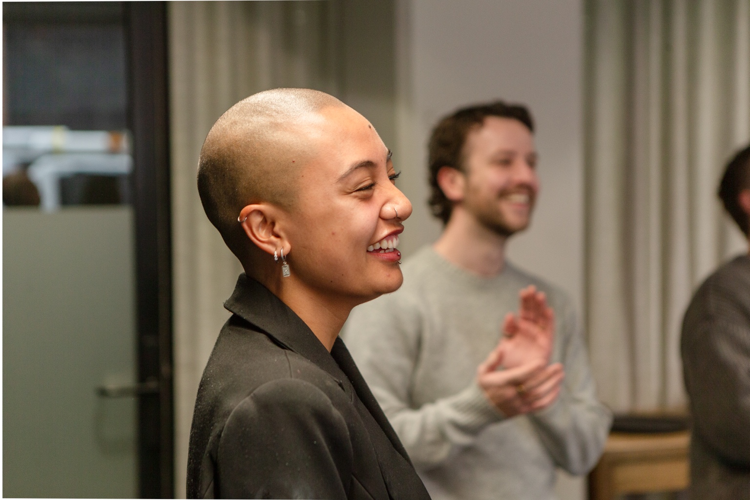 A workshop participant smiling during an activity